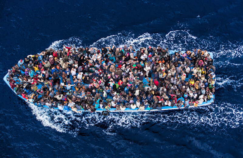 Italian navy rescues asylum seekers in the Mediterranean off the coast of Africa, June 2014. <br>CREDIT: <a href="https://www.flickr.com/photos/vfutscher/42322119744">Massimo Sestini/Polaris</a> <a href="https://creativecommons.org/licenses/by-nc/2.0/">(CC)</a>.