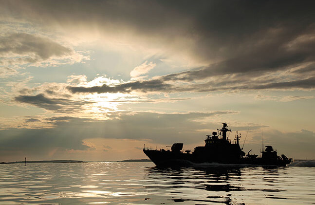 CREDIT: <a href="http://www.shutterstock.com/pic-89200546/stock-photo-warship-with-threatening-sky.html">Warship with threatening sky</a> via Shutterstock
