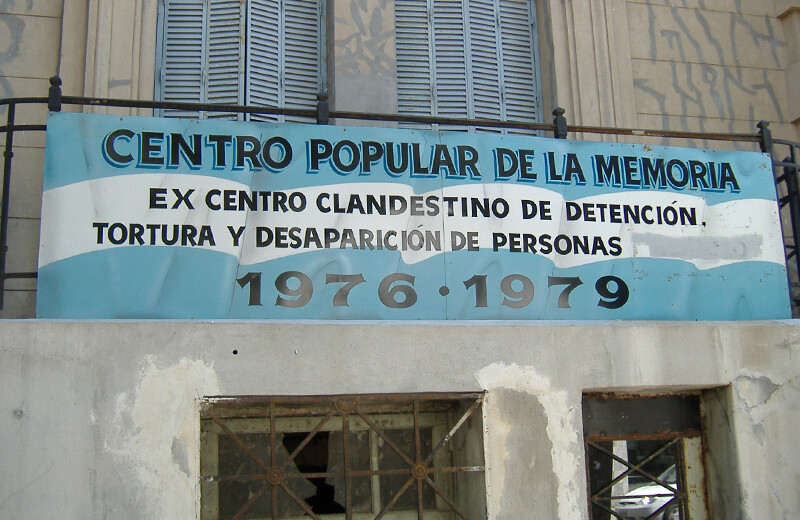 Centro Popular de la Memoria in Rosario, Argentina (in English, "Former illegal center of detention, torture and disappearance of persons, 1976–1979"). <A href=https://commons.wikimedia.org/wiki/File:Centro_Popular_de_la_Memoria_Rosario.jpg>CREDIT: Wikimedia (CC)</a>