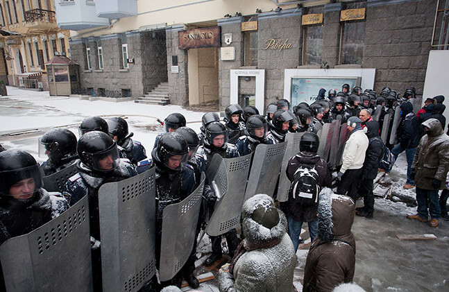 <a href="http://www.shutterstock.com/pic-172917470/stock-photo-kiev-ukraine-jan-police-squads-protect-the-government-quarter-of-the-common-people-on-the.html?src=tuJuBM6qfJGPSjK4MMwu1A-1-3">Police and Protesters, Kiev, Jan 2014</a> via Shutterstock