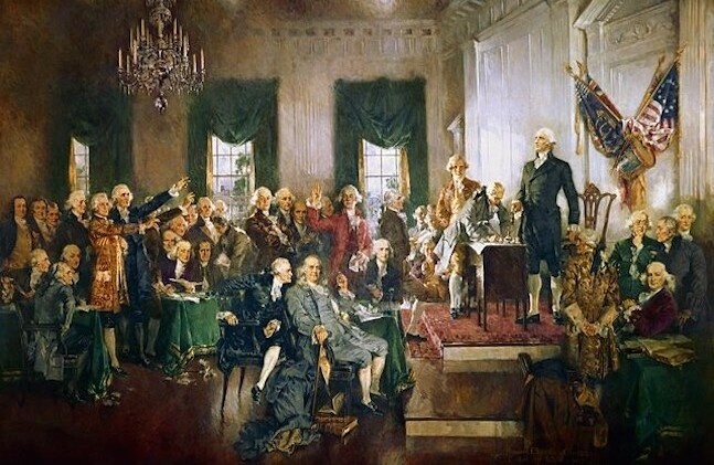 Signing of the U.S. Constitution by Howard Chandler Christy. Public Domain via <a href="https://en.wikipedia.org/wiki/George_Washington#/media/File:Scene_at_the_Signing_of_the_Constitution_of_the_United_States.jpg">Wikipedia</a>