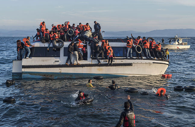 CREDIT: <a href="https://commons.wikimedia.org/wiki/File:20151030_Syrians_and_Iraq_refugees_arrive_at_Skala_Sykamias_Lesvos_Greece_2.jpg" target="_blank">Ggia - Wikimedia (CC)</a>. Syrian and Iraqi refugees arrive at Lesvos, Greece, October 2015.