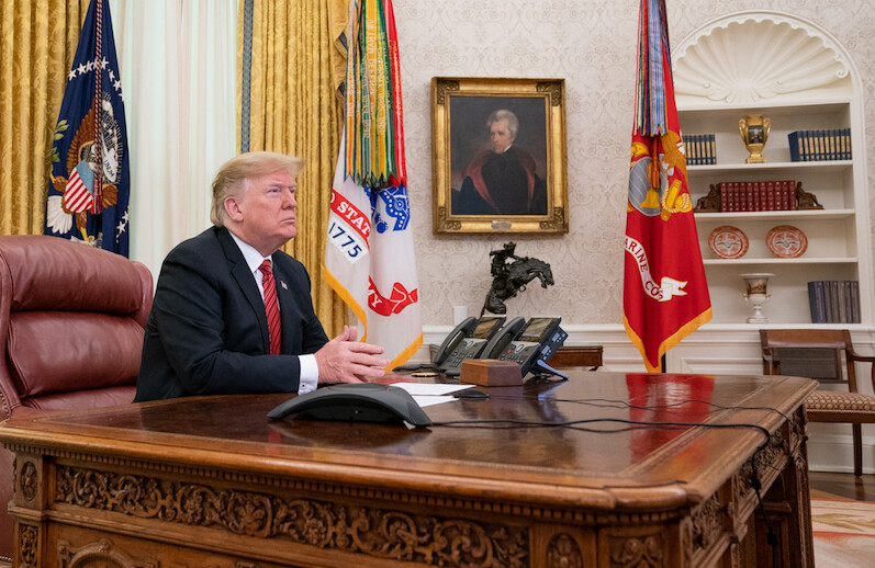 President Trump in the Oval Office on Christmas Day, 2018. CREDIT: <a href="https://www.flickr.com/photos/whitehouse/32629901988">Official White House Photo by Shealah Craighead/Public Domain</a>