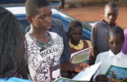 Ex-child soldier in Uganda reads to his comrades. <br>CREDIT: <a href="http://www.flickr.com/photos/18199113@N02/1986610953/in/photostream/" target=_blank">Robin Yamaguchi </a>