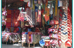 Coloured textiles in Rue Semarine, Marrakech <br>Photo by Martin Dady