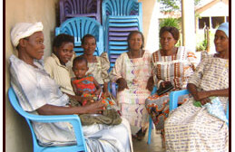 Women's Group in Kitengesa, Uganda <br>with Newly Purchased Chairs.