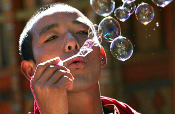 Bhutanese monk blowing bubbles. CREDIT: <a href="http://flickr.com/photos/babasteve/2249740073/">Steve Evans</a> (<a href="http://creativecommons.org/licenses/by/2.0/deed.en">CC</a>).