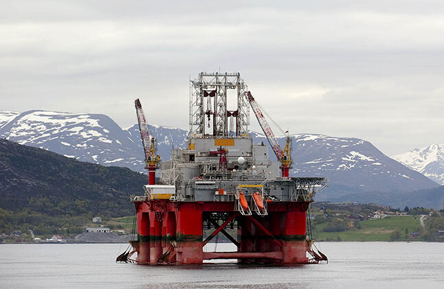 Oil rig in a Norwegian fjord. CREDIT: <a href="http://www.shutterstock.com/pic-68866420/stock-photo-oil-rig-between-mountains-in-a-norwegian-fjord.html?src=3FK3s61ppF753wPvPJoO_A-1-97">Shutterstock</a>