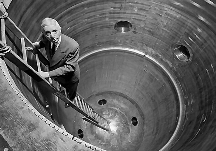 Admiral Rickover descends into the circular nuclear reactor shell at the Shippingport Power Facility. Courtesy of LIFE magazine, via <a href="https://commons.wikimedia.org/wiki/File:Admiral_Rickover_descends_into_the_nuclear_reactor_shell_at_the_Shippingport_Power_Facility_(14492227730).jpg">Wikipedia</a>..