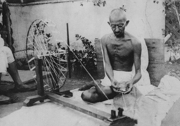 Mahatma Gandhi spinning yarn, in the late 1920s. Public Domain via <a href="http://en.wikipedia.org/wiki/Mahatma_Gandhi#/media/File:Gandhi_spinning.jpg">Wikipedia</a>