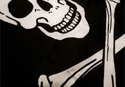 Pirate flag skull and crossbones. Photo by <br><a href="http://flickr.com/photos/nickhumphries/1405653435/">Nick Humphries</a> (<a href="http://creativecommons.org/licenses/by-nc-nd/2.0/deed.en">CC</a>).