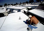 White roof paint. Credit: <a href="http://www.flickr.com/photos/nhbdy/153067064/">Chris Dick</a> (<a href="http://creativecommons.org/licenses/by-sa/2.0/deed.en">CC</a>).
