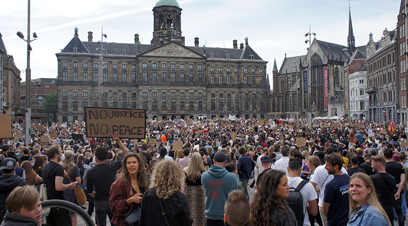 Solidarity protest against anti-black violence in Amsterdam, The Netherlands, June 2020. Credit: <a href=https://commons.wikimedia.org/wiki/File:Solidarity_Protest_Against_Anti-black_violence_in_the_US_and_EU_DSC02745.jpg>Karen Elliot/Wikimedia (CC)</a>.
