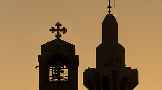 <a href="http://www.shutterstock.com/pic-34762768/stock-photo-a-minaret-of-the-king-hussein-mosque-and-the-steeple-of-the-coptic-orthodox-church-silhouetted-on.html?src=BwCDN9pOUWbl0oBPEnD7Hg-1-1">Amman Skyline Silhouette</a> via Shutterstock