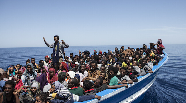 May 2, 2015. A boat carrying 369 mainly Eritrean migrants, 45 km off the Libyan coast. The bilge pump was blocked and water was pouring in. Everyone was evacuated safely to a rescue boat and taken to Sicily. ©Jason Florio - all rights reserved.