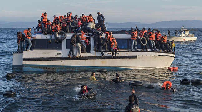 CREDIT: <a href="https://commons.wikimedia.org/wiki/File:20151030_Syrians_and_Iraq_refugees_arrive_at_Skala_Sykamias_Lesvos_Greece_2.jpg" target="_blank">Ggia - Wikimedia (CC)</a>. Syrian and Iraqi refugees arrive at Lesvos, Greece, October 2015.