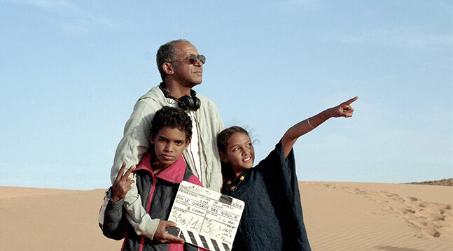 Director Abderrahmane Sissako with cast. <a href="http://cohenmedia.filmtrackonline.com/extranet/pages/explorerview.aspx?projectId=9d925386-5c1e-e411-ba69-d4ae527c3b65">Cohen Media</a>