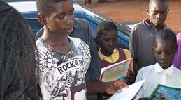 Ex-child soldier in Uganda reads to his comrades. <br>CREDIT: <a href="http://www.flickr.com/photos/18199113@N02/1986610953/in/photostream/" target=_blank">Robin Yamaguchi </a>