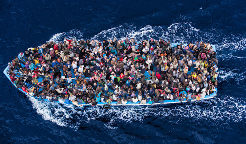 Italian navy rescues asylum seekers in the Mediterranean off the coast of Africa, June 2014. <br>CREDIT: <a href="https://www.flickr.com/photos/vfutscher/42322119744">Massimo Sestini/Polaris</a> <a href="https://creativecommons.org/licenses/by-nc/2.0/">(CC)</a>.