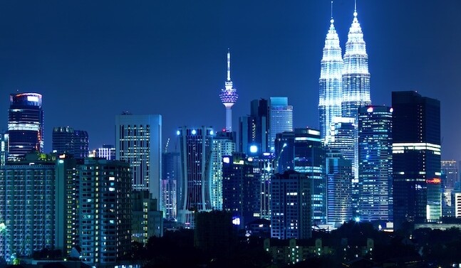 Skyline of Kuala Lumpur, Malaysia via <a href="http://www.shutterstock.com/pic-149398187/stock-photo-kuala-lumpur-skyline-at-night.html">Shutterstock</a>