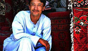 Carpet vendor in Kabul, Afghanistan <br>(2005). Photo by <a href="http://flickr.com/photos/babasteve/25456049/">Steve Evans</a> (<a href="http://creativecommons.org/licenses/by/2.0/deed.en-us">CC</a>).