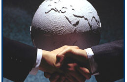 Globe in background handshake in foreground
