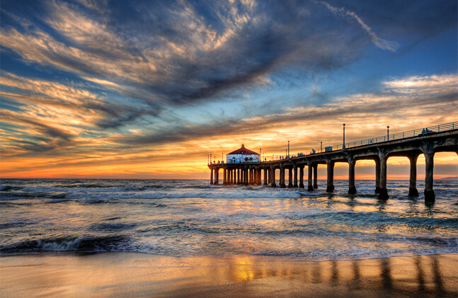 Photo of pier at sunset by Pedro Szekely,