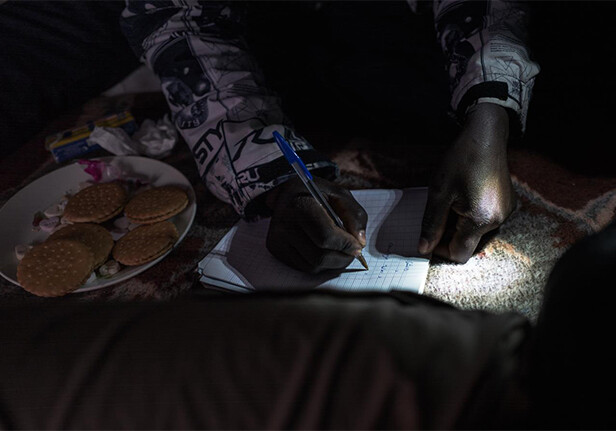 Musa, pictured here during Arabic lessons, fled Darfur at the onset of the war in 2002. While his family headed to the refugee camps in neighbouring Chad, where they remain to this day, he began the journey to Europe. He has not seen them since.