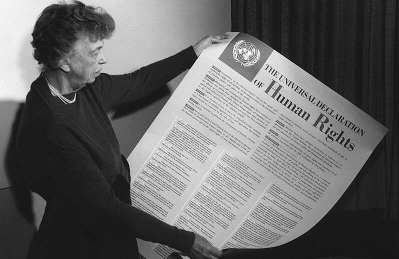 Eleanor Roosevelt holding a poster of the Universal Declaration of Human Rights, Lake Success, NY, November, 1949. <br>CREDIT: <a href="https://en.wikipedia.org/wiki/Universal_Declaration_of_Human_Rights#/media/File:Eleanor_Roosevelt_UDHR.jpg">Wikimedia</a> <a href="https://creativecommons.org/licenses/by/2.0/deed.en">(CC)</a>
