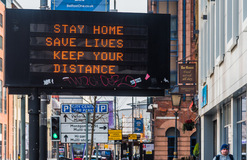 Belfast, Northern Ireland, March 24, 2020. CREDIT: <a href="https://commons.wikimedia.org/wiki/File:Belfast_COVID19_Traffic_Management_Sign.jpg">Gerry Lynch (CC)</a>