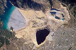Berkeley Pit, Montana. CREDIT: <a href="http://www.nasa.gov/multimedia/imagegallery/image_feature_697.html">NASA</a> (<a href="http://commons.wikimedia.org/wiki/File:Berkeley_Pit_Butte,_Montana.jpg">wikimedia</a>)
