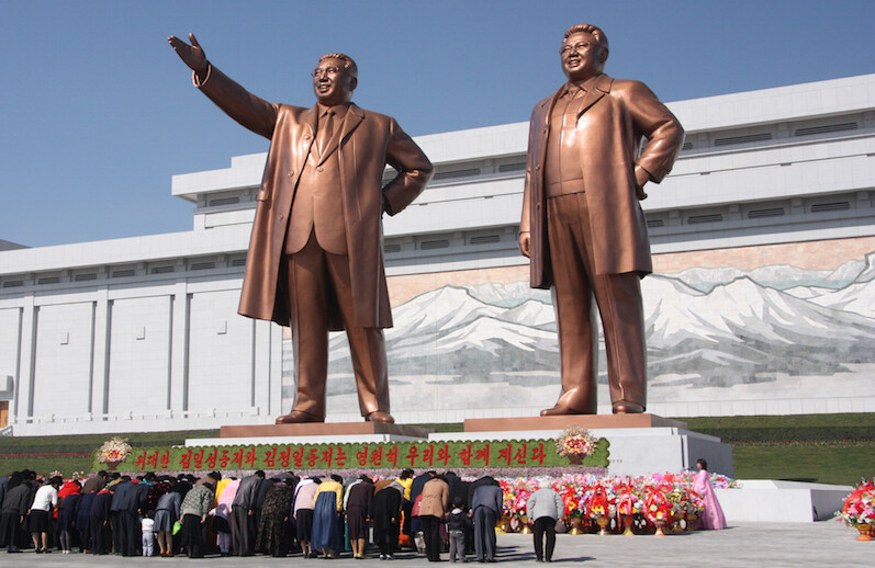 Statues of Kim Il-sung and Kim Jong-il at the Mansu Hill Grand Monument, Pyongyang. CREDIT: <a href="https://commons.wikimedia.org/wiki/File:The_statues_of_Kim_Il_Sung_and_Kim_Jong_Il_on_Mansu_Hill_in_Pyongyang_(april_2012).jpg">J.A. de Roo (CC)</a>