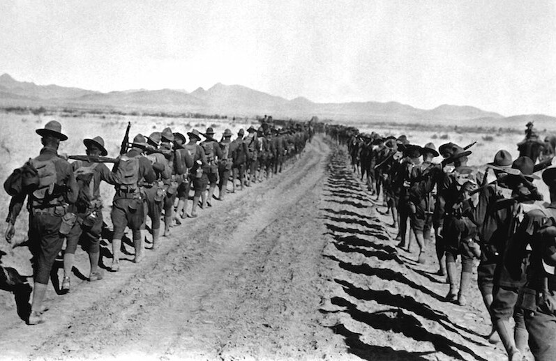 Pancho Villa Expedition. Column of 6th and 16th Infantry, between Corralitos Rancho and Ojo Federico, January 1917. <br>CREDIT: <a href="https://commons.wikimedia.org/wiki/File:Pancho_Villa_Expedition_-_Infantry_Columns_HD-SN-99-02007.JPEG">C. Tuckber Beckett/U.S. Department of Defense/Public Domain</a>