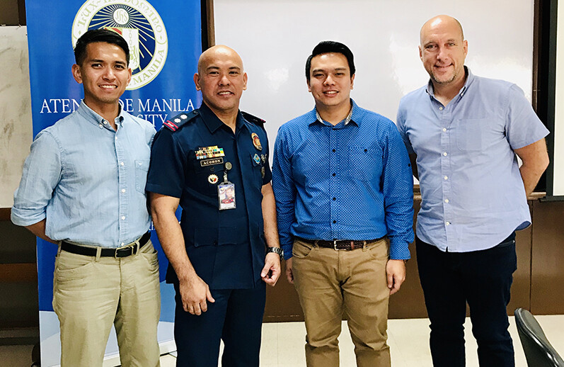 Mark Payumo in Manila last October with a Philippine National Police Officer, Pacific Fellow Tom Temprosa, & Devin Stewart. <br>CREDIT: Amanda Ghanooni.