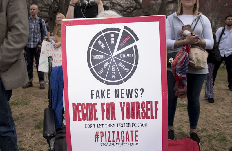 "Pizzagate" conspiracy protest, March 2017. CREDIT: <a href="https://www.flickr.com/photos/blinkofanaye/33496659222">Blink O'fanaye</a> <a href="https://creativecommons.org/licenses/by-nc/2.0/">(CC)</a>