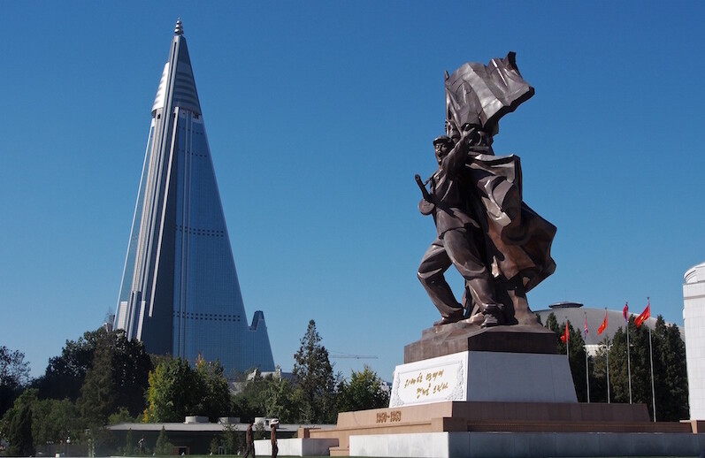 Ryugyong Hotel and Victorious Fatherland Liberation War Museum, Pyongyang, North Korea. CREDIT: <a href="https://commons.wikimedia.org/wiki/File:Victorious_Fatherland_Liberation_War_Museum_and_Ryugyong_Hotel_(11342673725).jpg">Clay Gilliland (CC)</a>