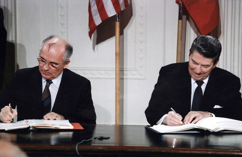 Reagan and Gorbachev signing the INF Treaty at the White House, December, 1987. CREDIT: <a href="https://commons.wikimedia.org/wiki/File:Reagan_and_Gorbachev_signing.jpg">White House Photographic Office/Public Domain</a>