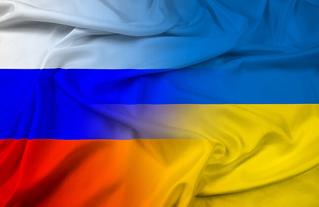 <a href="http://www.shutterstock.com/pic.mhtml?id=181796219">Russian and Ukrainian flags  </a> via Shutterstock