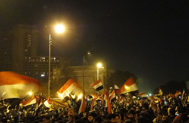 Flag of Egypt all over Tahrir Square by <a href="http://www.flickr.com/photos/ramyraoof/5436339799/" target=_blank">Ramy Raoof </a>