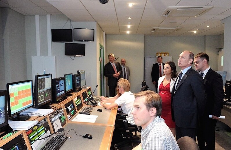 Vladimir Putin visits the new Russia Today (RT) broadcasting center, 2012. CREDIT: <a href="https://en.wikipedia.org/wiki/RT_(TV_network)#/media/File:Vladimir_Putin_-_Visit_to_Russia_Today_television_channel_2.jpg">Kremlin.ru</a> (<a href="https://creativecommons.org/licenses/by/3.0/">CC</a>)