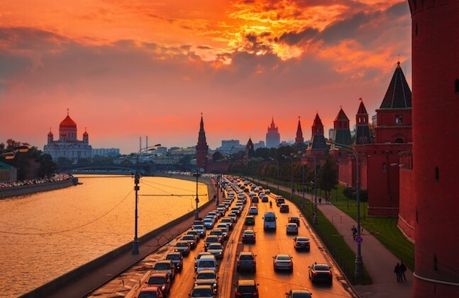 The Kremlin in Moscow via <a href="http://www.shutterstock.com/pic-191341382/stock-photo-traffic-at-sunset-near-kremlin-wall-in-moscow-russia.html">Shutterstock</a>