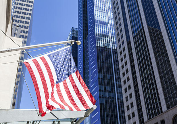 CREDIT: <a href="- http://www.shutterstock.com/pic-231458125/stock-photo-american-flag-in-the-city.html">Shutterstock</a>