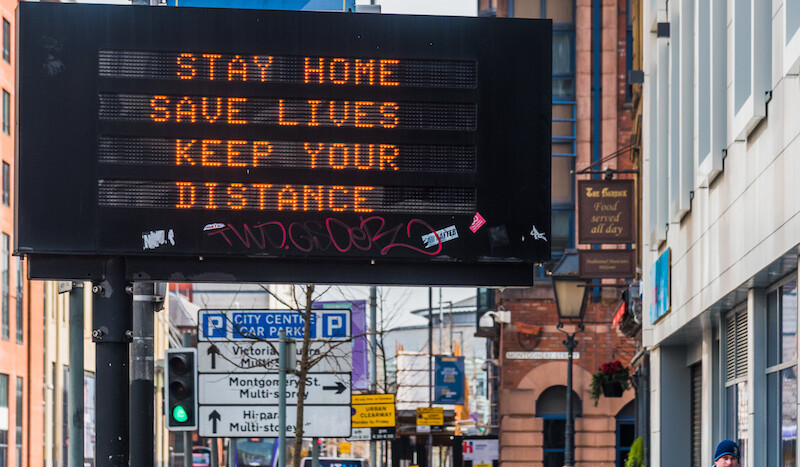 Belfast, Northern Ireland, March 24, 2020. CREDIT: <a href="https://commons.wikimedia.org/wiki/File:Belfast_COVID19_Traffic_Management_Sign.jpg">Gerry Lynch (CC)</a>