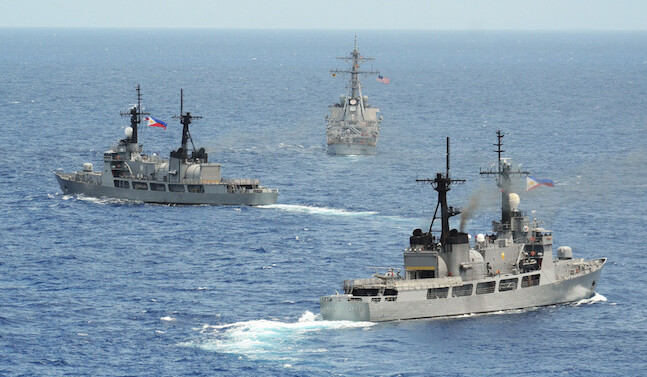 USS "John S. McCain" and Philippine navy frigates BRP "Gregaorio del Pilar" & "Ramon Alcaraz" (Top to Bottom), South China Sea, 2014. <br>CREDIT: <a href="http://bit.ly/2cKolI3">U.S. Pacific Fleet</a> <a href="http://bit.ly/1jNlqZo">(CC)</a>